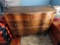 Antique Oak Curved 4-Drawer Dresser with Beveled Edge Mirror.