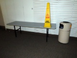 Metal Trash Can, 8' Table, Caution Wet Floor Sign.