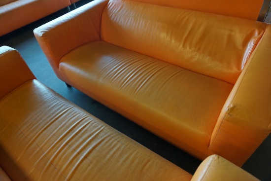 (3) Orange Faux Leather Couches.