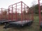Stoltzfus Manufacturing Tri-Axle Flatbed Trailer with Hay Rack