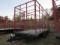 Stoltzfus Manufacturing Tri-Axle Flatbed Trailer with Hay Rack