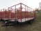 Stoltzfus Manufacturing Tri-Axle Flatbed Trailer with Hay Rack