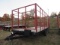 Stoltzfus Manufacturing Tri-Axle Flatbed Trailer with Hay Rack