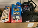 Assorted Hot Wheels Cars, Monster Trucks, and (3) Carrying Cases