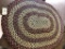 Reddish Oval Hand Braided Rug