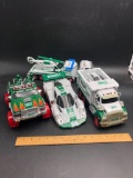 (4) Large Collectible Hess Trucks