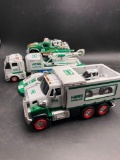 (4) Large Collectible Hess Trucks