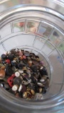 Glass Barrel Half Full of Buttons