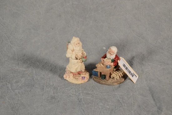 (2) United Design Cast Resin Santa Figurines