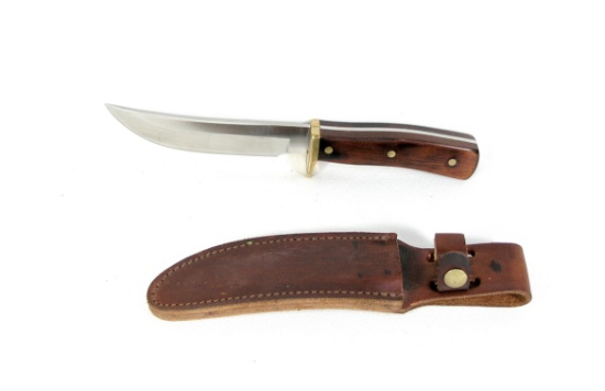 Schrade U.S.A. #165 Uncle Henry hunting knife. It has wood laminate handle