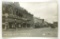 548.  1930’s RPPC Neosho, MO West Side Square with period automobiles, Coin