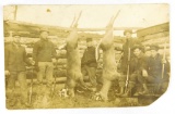18.  RPPC:  c1916 E. Farrier Wisconsin Hunting Camp with a Pair of Trophy W