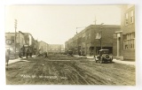 135.  1920’s RPPC Main Street Spooner, Wis.  Dirt Main Street; Period Autos