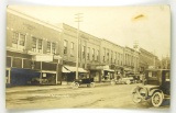 537.  c1915 RPPC Petoskey, Mich. Mitchell Street with period Automobiles an