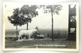 541.  1930’s RPPC Ossineke, Mich. Log lookout; Huge Bull Statue; Texaco Gas