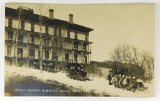 552.  1920’s RPPC Winter Sports A Beulah Home Boyne City, Mich. With 19 kid