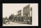 AMHERST JCT: RPPC of Brick Block to East at AMHERST JCT., WIS. Wagon headed