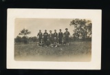 ADAMS CENTER:  Baseball Team stands on Grassy Knoll  Various teams includin