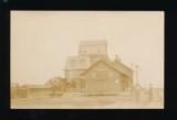 AINSWORTH: 1912 Depot and Grain Elevator with Threshing Machine on track at