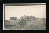 AMHERST:  1910 RPPC Threshing Crew of J. M. Peterson Outfit with a mighty R