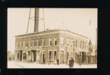 AUGUSTA: 1909 RPPC of Large Brick Business Building at Augusta.  SIZE:  Rig