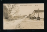 AURORAHVILLE: 1916 MAIN St. AUROURAHVILLE WIS. RPPC Wagons on snow covered