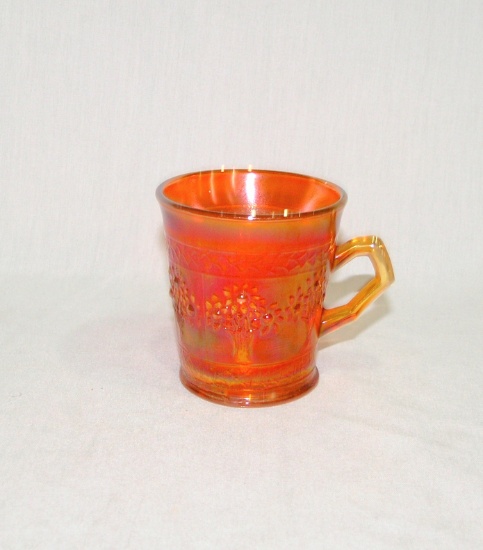 Vintage Marigold Carnival Glass Cup with Orange Tree Pattern.