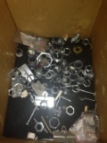 box of electircal parts faceplates and pegboard hooks.