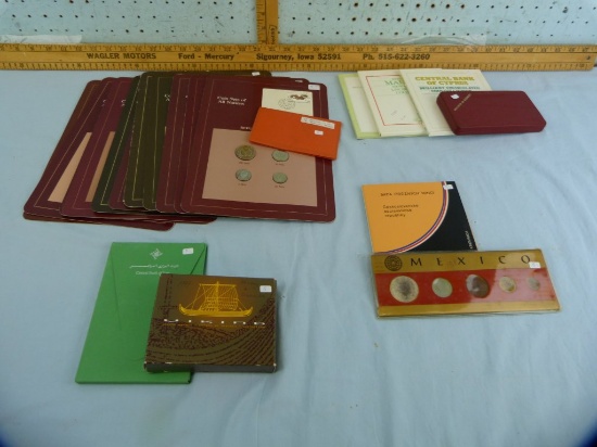 20 items: foreign coin sets, 12 w/stamps
