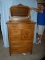 Oak highboy with mirror, 69