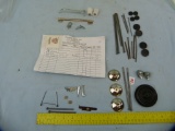 Assortment of toy car parts: wheels, headlights, etc.