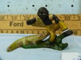 Black Memorabilia cast iron can opener, man w/alligator, 2-1/2