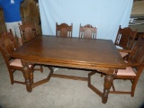 Expandable dining table with captain's chair & 5 side chairs