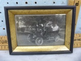 Framed black & white postcard of old Ford model car