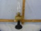 Parlor kerosene lamb with amber glass reservoir & dark glass base
