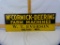 McCormick-Deering Farm Machines tin sign, business name added later