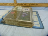 Approx 374 postcards in notebook