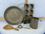 5 Kitchen items: muffin pan, sifter, strainer, colander, wood spatula