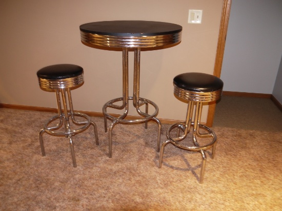 Newer chrome leg tall bar table with 2 stools; table 40-1/2" T x 30" diameter; stools 28-1/2" T