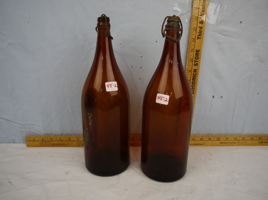 (2) colored glass "picnic" bottles with caps & bails