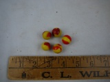 (5) yellow and orange marbles