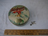 (2) items: 1939 New York World's Fair airplane pin & Fralinger's Salt Water Taffy tin