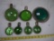 (7) green glass reflectors, one has a crack, 6