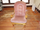 Glider rocker with oak trim