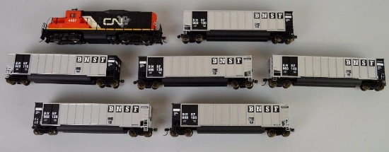 HO Train Grouping of 7 including Walthers engine and 6 hoppers