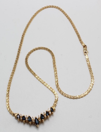 NECKLACE. DARK BLUE SAPPHIRE AND DIAMOND. 14K YELLOW GOLD