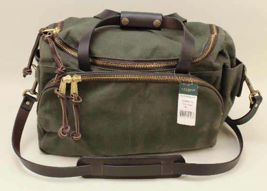 1 new Filson Sportsman bag.
