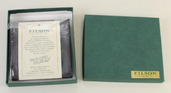 1 new Filson leather Packer wallet.