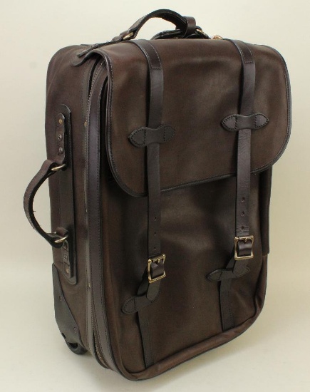 1 new Filson weatherproof mediuim rolling carry-on bag.