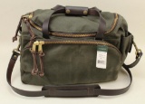 1 new Filson Sportsman bag.